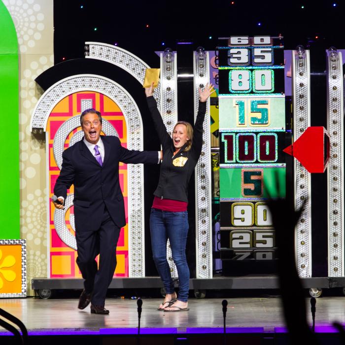 The Price is Right wheel landed on 1.00 with lady and host celebrating