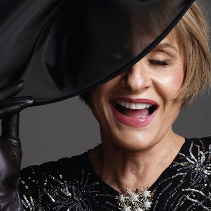 Patti Lupone in a big black hat