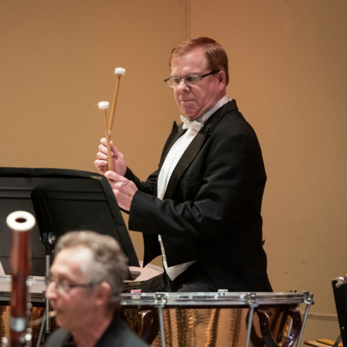 Man in a tux playing the drums