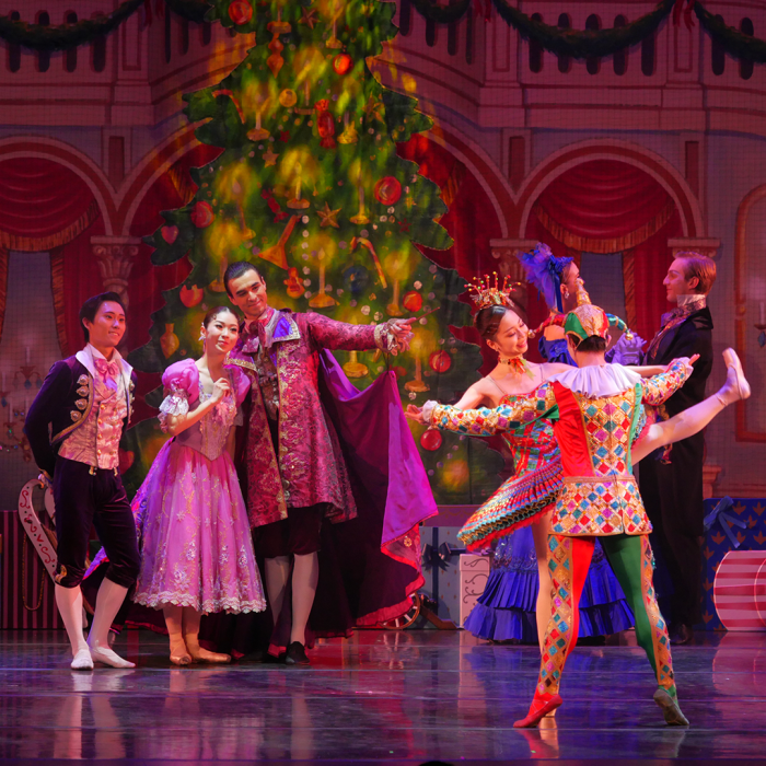 A couple looking happy at the nutcracker dancing