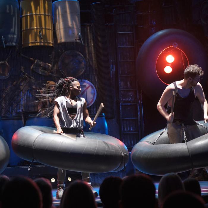 Musicians playing air tires as drums