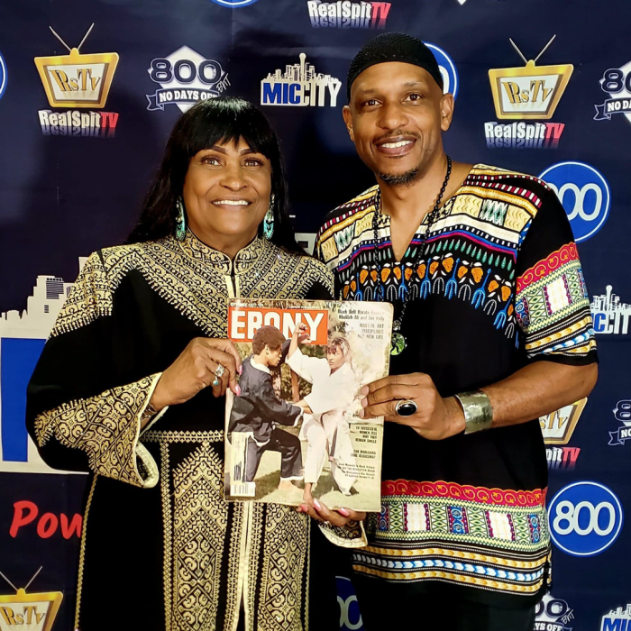 Lady and man holding the Ebony magazine