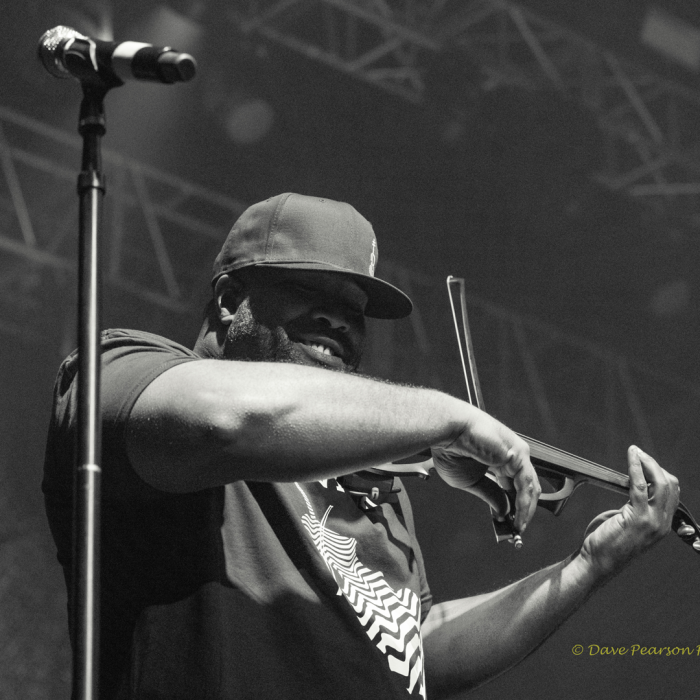 Black and white photo of a gentleman playing a violin close up